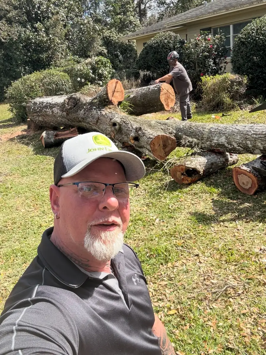 ArboristRX owner on a tree removal job site in Edgewater FL